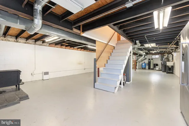 a view of an empty room with stairs