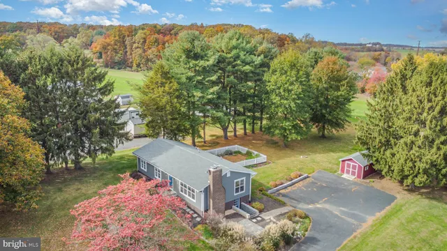 an aerial view of a house with outdoor space