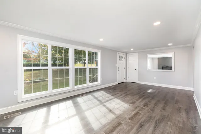 a view of empty room with windows