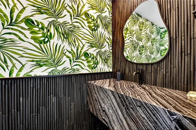 a bedroom with a large bed and balcony