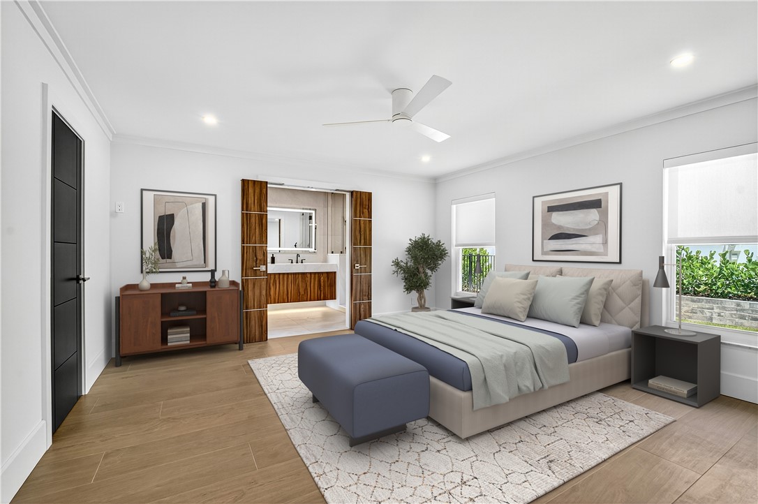 661 Date Palm Road Vero Beach, FL 32963 - Photo 13 of 34 a bedroom with a large bed and balcony