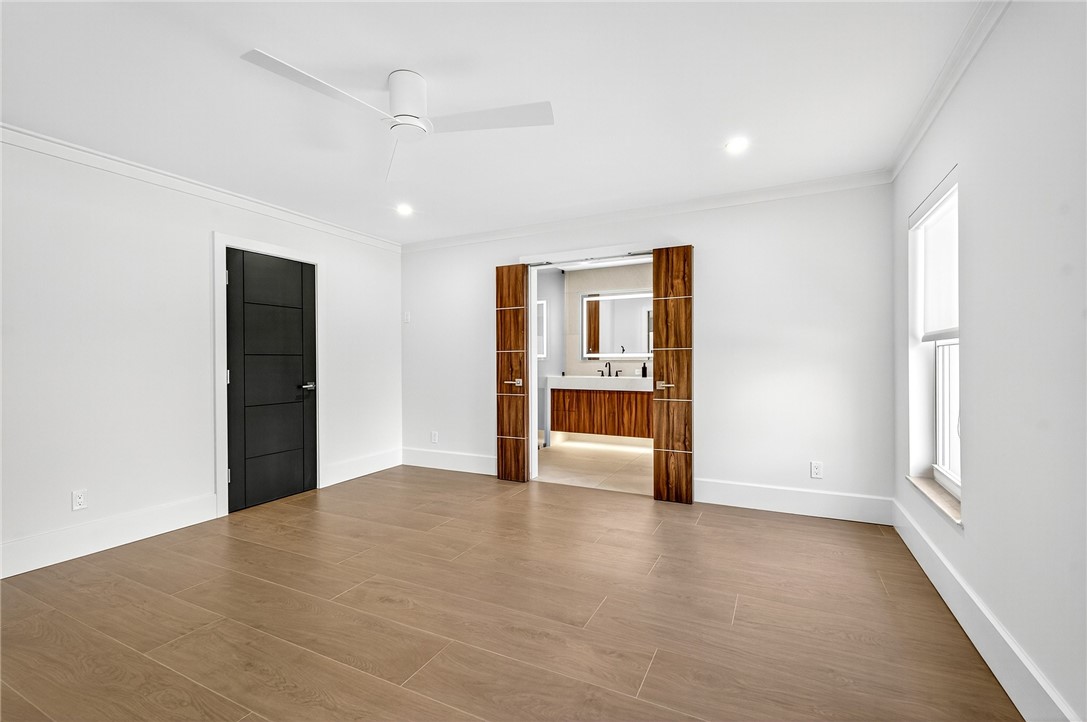 661 Date Palm Road Vero Beach, FL 32963 - Photo 14 of 34 a view of a livingroom with wooden floor and a refrigerator