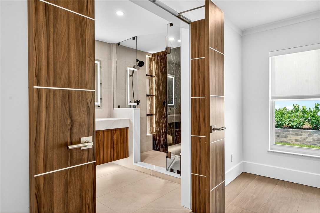 661 Date Palm Road Vero Beach, FL 32963 - Photo 17 of 34 a view of walk in closet with window