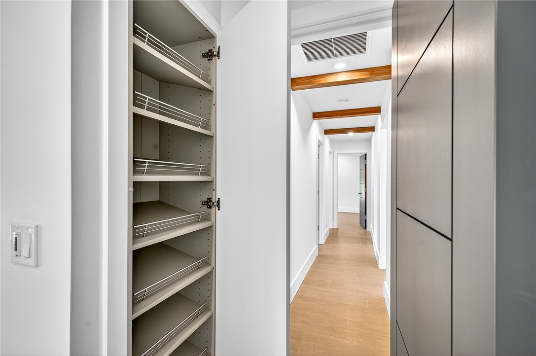 661 Date Palm Road Vero Beach, FL 32963 - Photo 20 of 34 a view of a hallway with wooden shelves