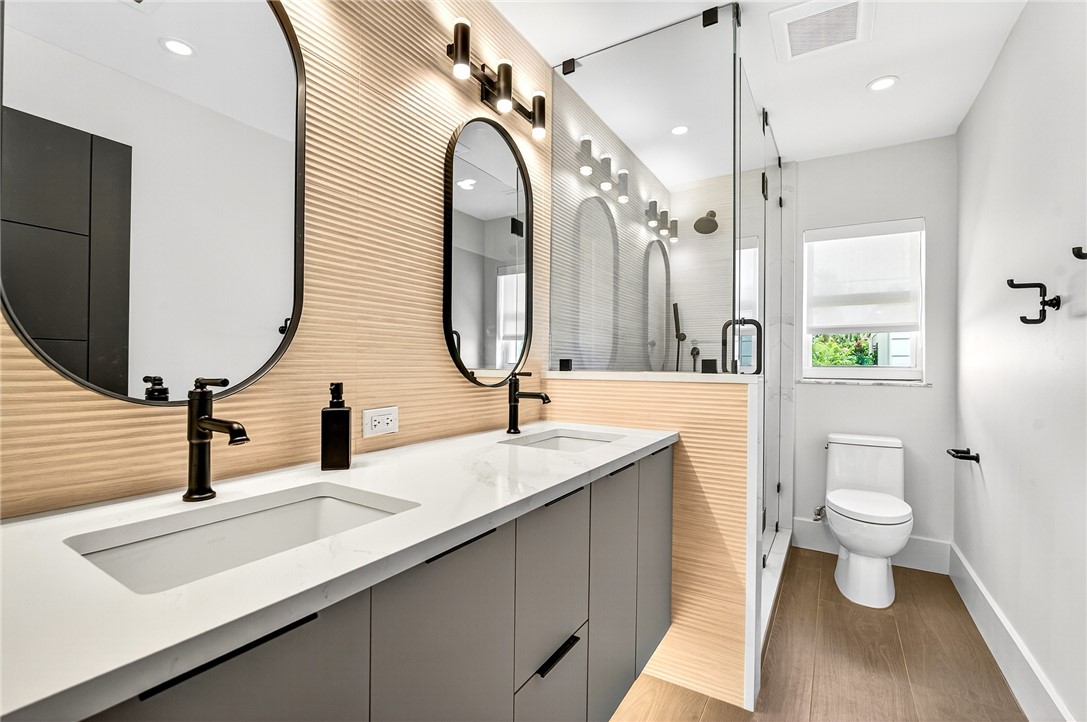661 Date Palm Road Vero Beach, FL 32963 - Photo 23 of 34 a bathroom with a sink and a mirror