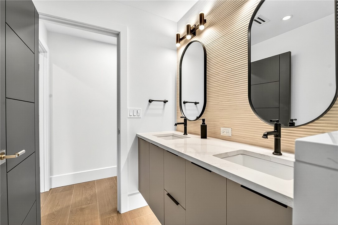 661 Date Palm Road Vero Beach, FL 32963 - Photo 24 of 34 a bathroom with a double vanity sink and a mirror