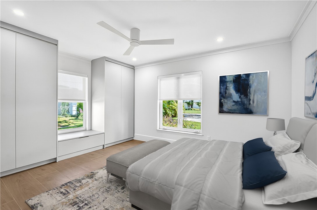 661 Date Palm Road Vero Beach, FL 32963 - Photo 26 of 34 a bedroom with a bed and a window