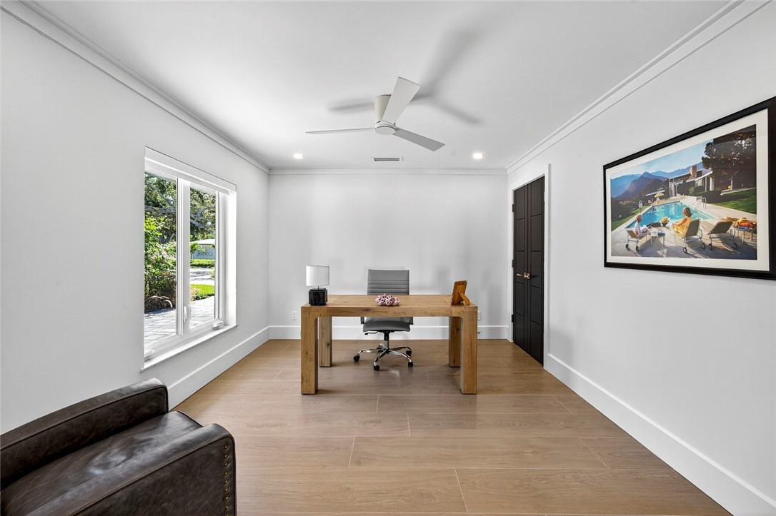 661 Date Palm Road Vero Beach, FL 32963 - Photo 27 of 34 a living room with furniture a piano and a window