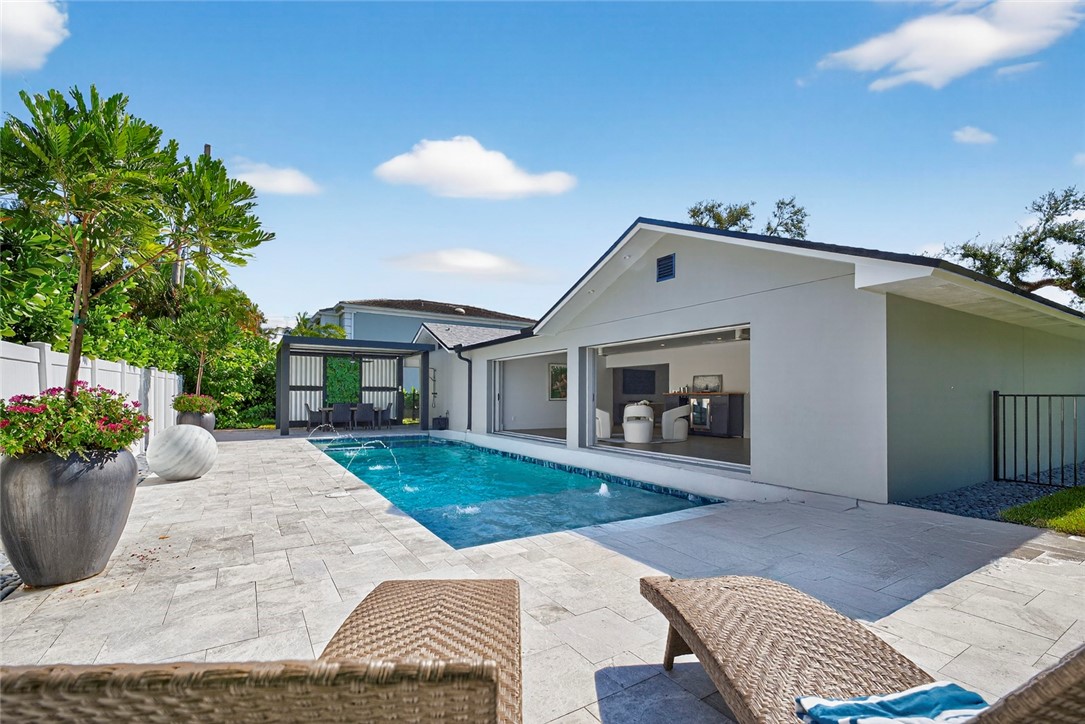 661 Date Palm Road Vero Beach, FL 32963 - Photo 30 of 34 a front view of a house with garden