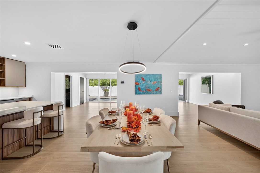 661 Date Palm Road Vero Beach, FL 32963 - Photo 6 of 34 a living room with furniture kitchen view and a large window