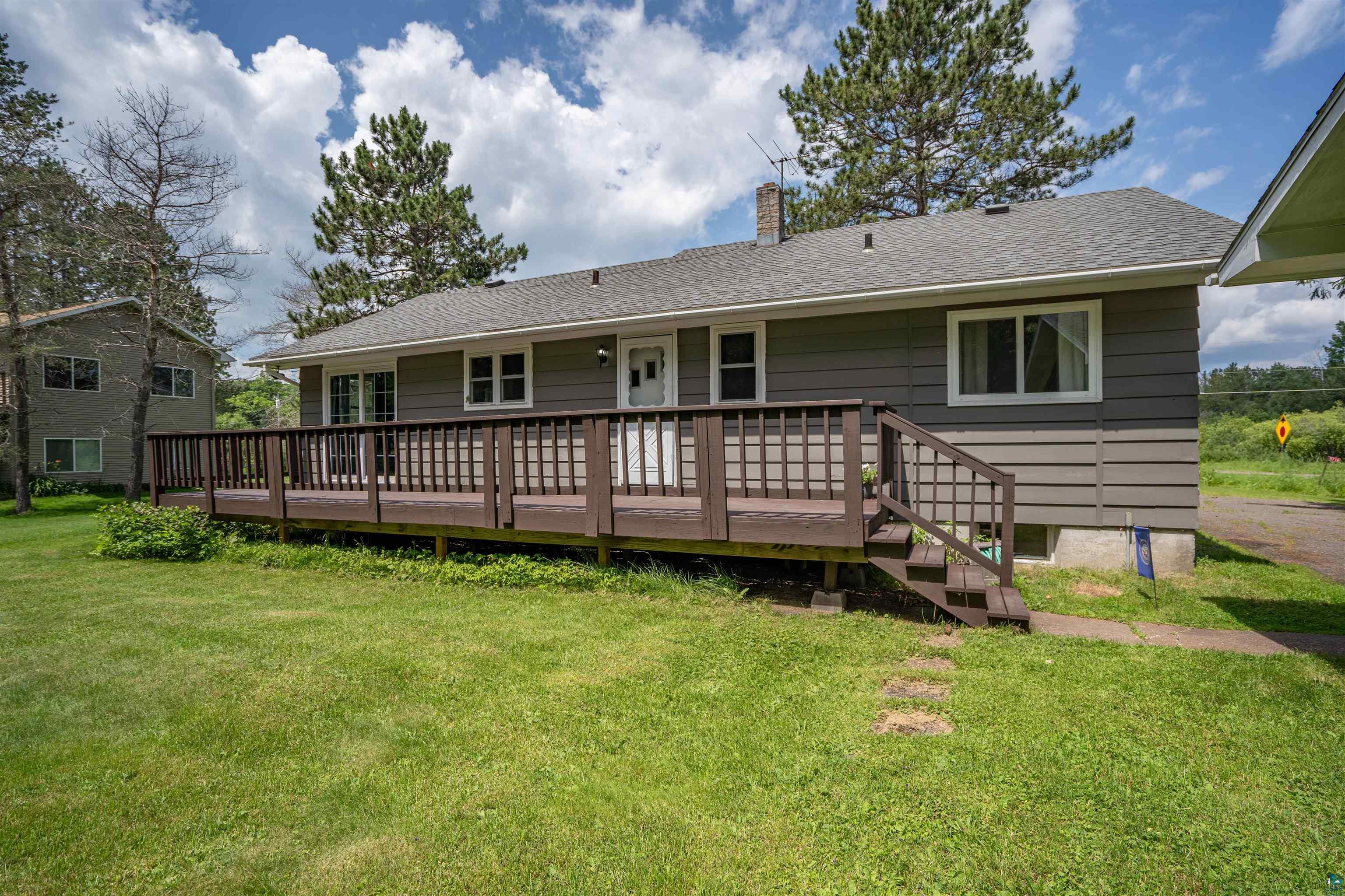 5716 North Pike Lake Road Duluth, MN 55811 - Photo 24 of 31 Rear view of property with a deck and a yard
