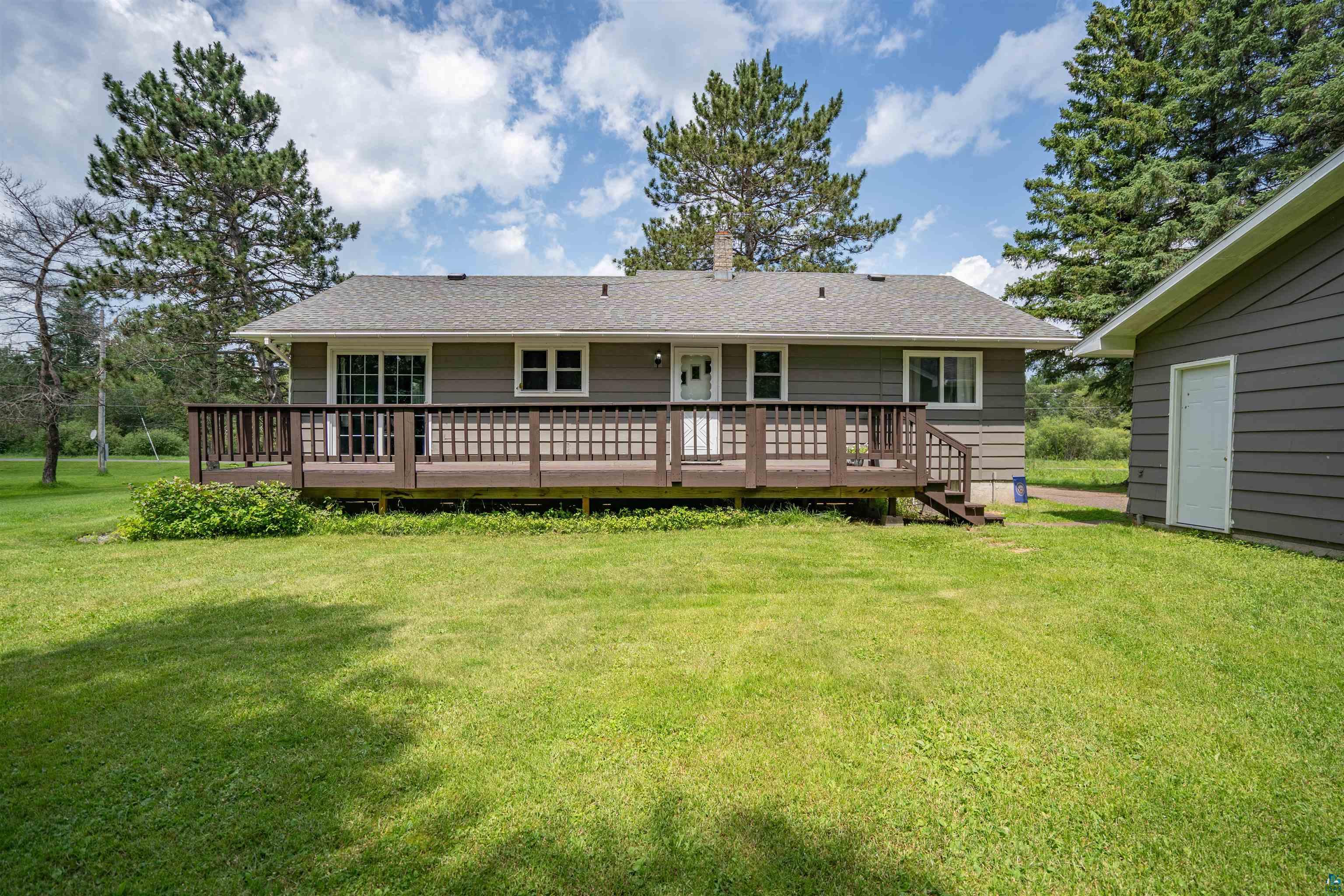 5716 North Pike Lake Road Duluth, MN 55811 - Photo 3 of 31 Back of house with a deck and a lawn