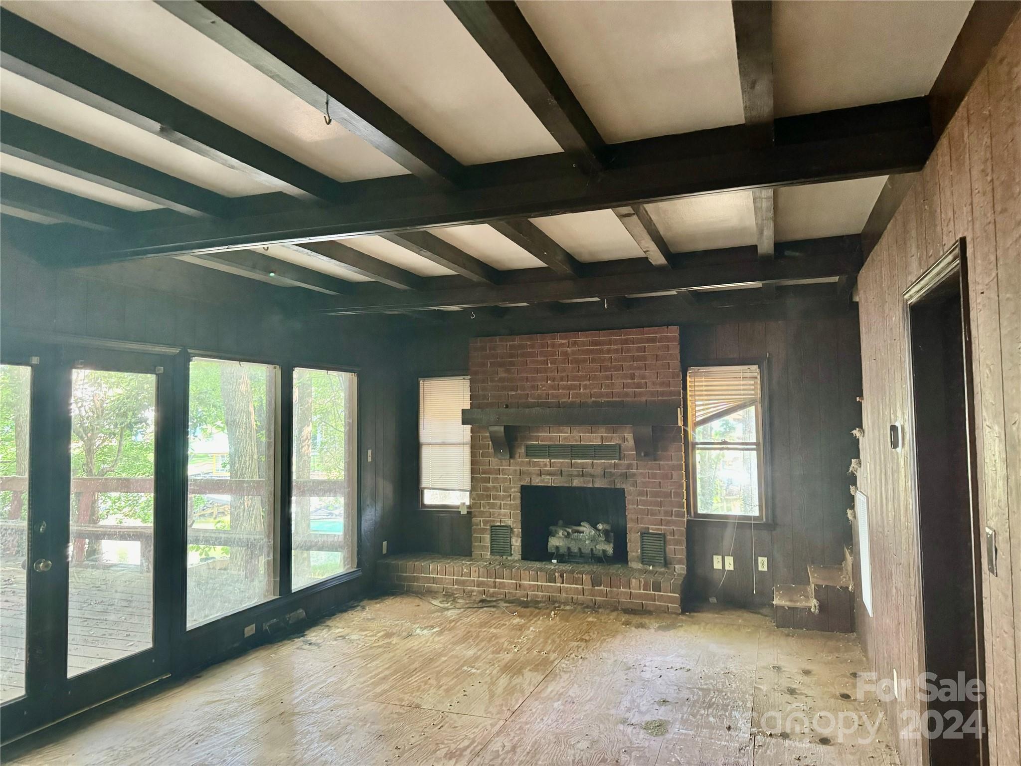 122 Stover Road Mooresville, NC 28117 - Photo 13 of 17 a view of an empty room with a fireplace and a window