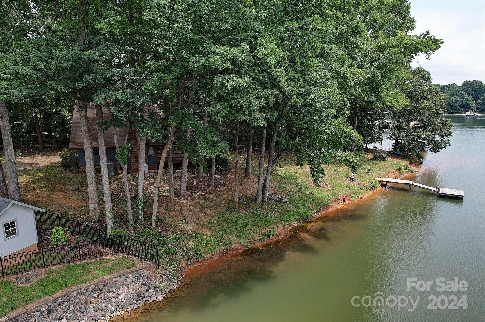 122 Stover Road Mooresville, NC 28117 - Photo 6 of 17 a view of a lake with a barn