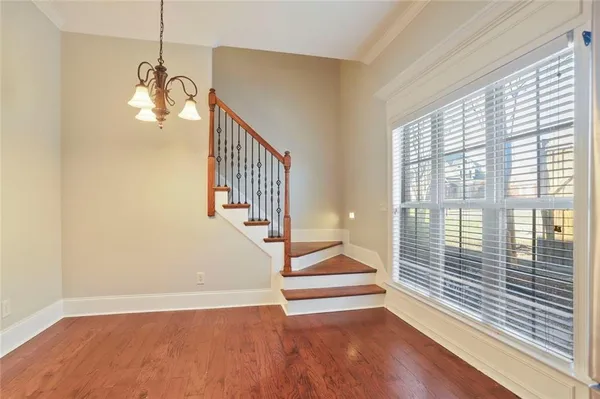 a view of an entryway with wooden floor