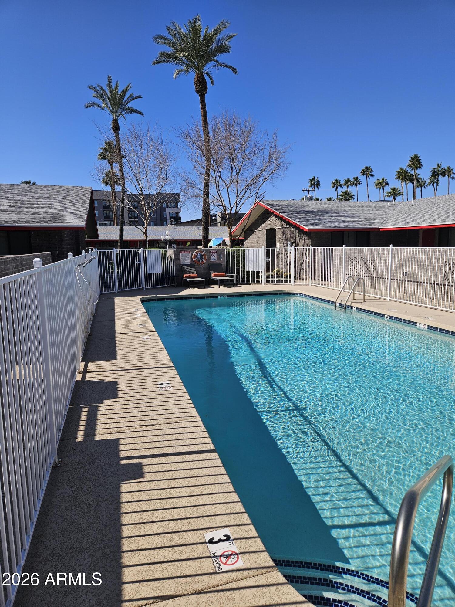 324 West Pasadena Avenue, Unit 8 Phoenix, AZ 85013 - Photo 22 of 22 a view of a balcony with two chairs