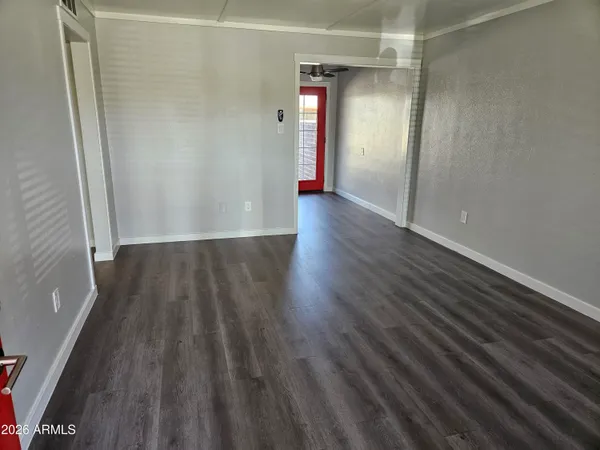 a view of wooden floor in an empty room
