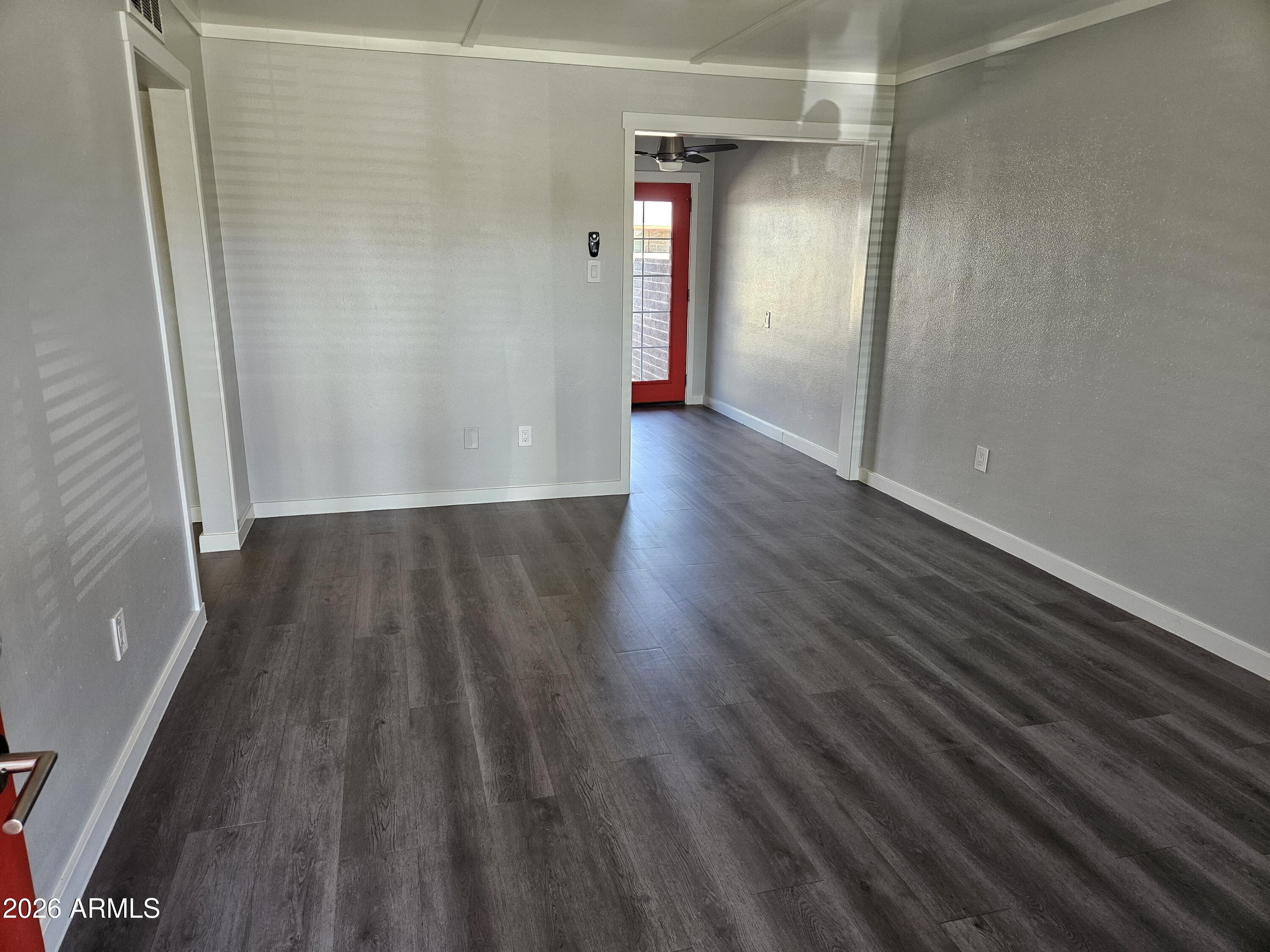 324 West Pasadena Avenue, Unit 8 Phoenix, AZ 85013 - Photo 3 of 22 a view of wooden floor in an empty room