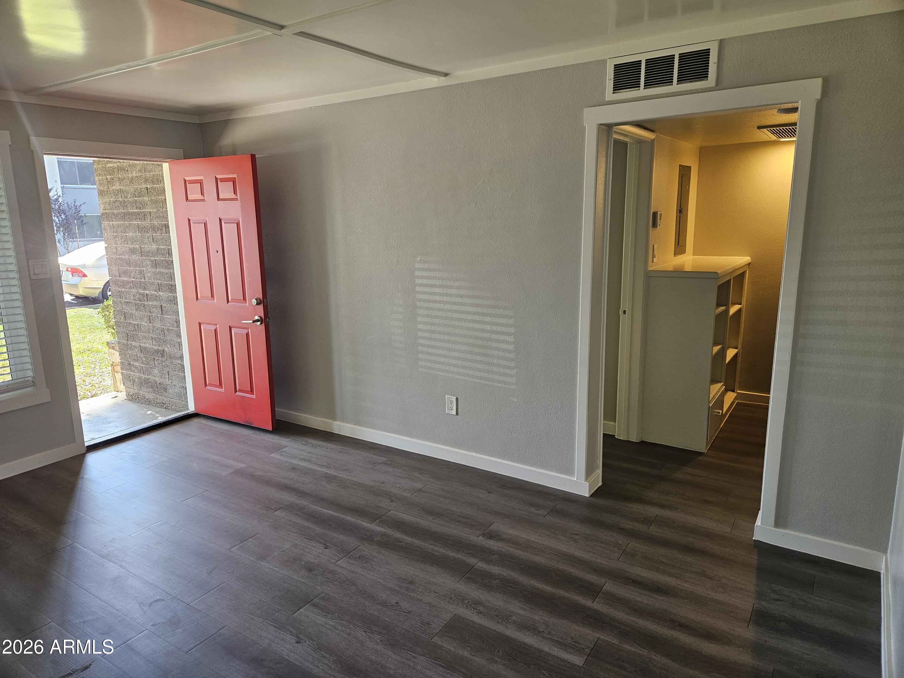 324 West Pasadena Avenue, Unit 8 Phoenix, AZ 85013 - Photo 8 of 22 a view of front door with wooden floor and stairs