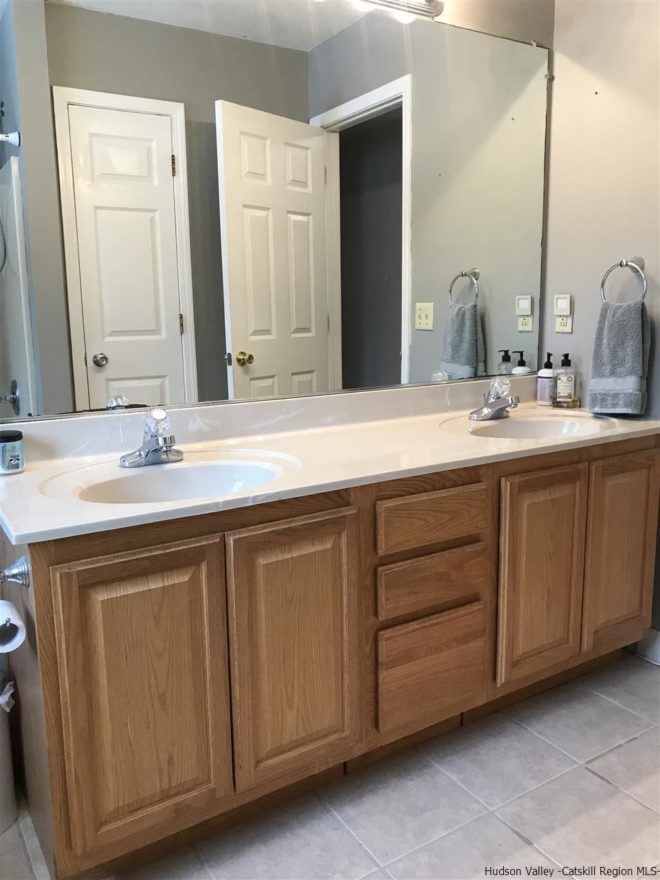 31 Camp Ridge Road Wallkill, NY 12589 - Photo 23 of 35 a bathroom with a double vanity sink and a mirror