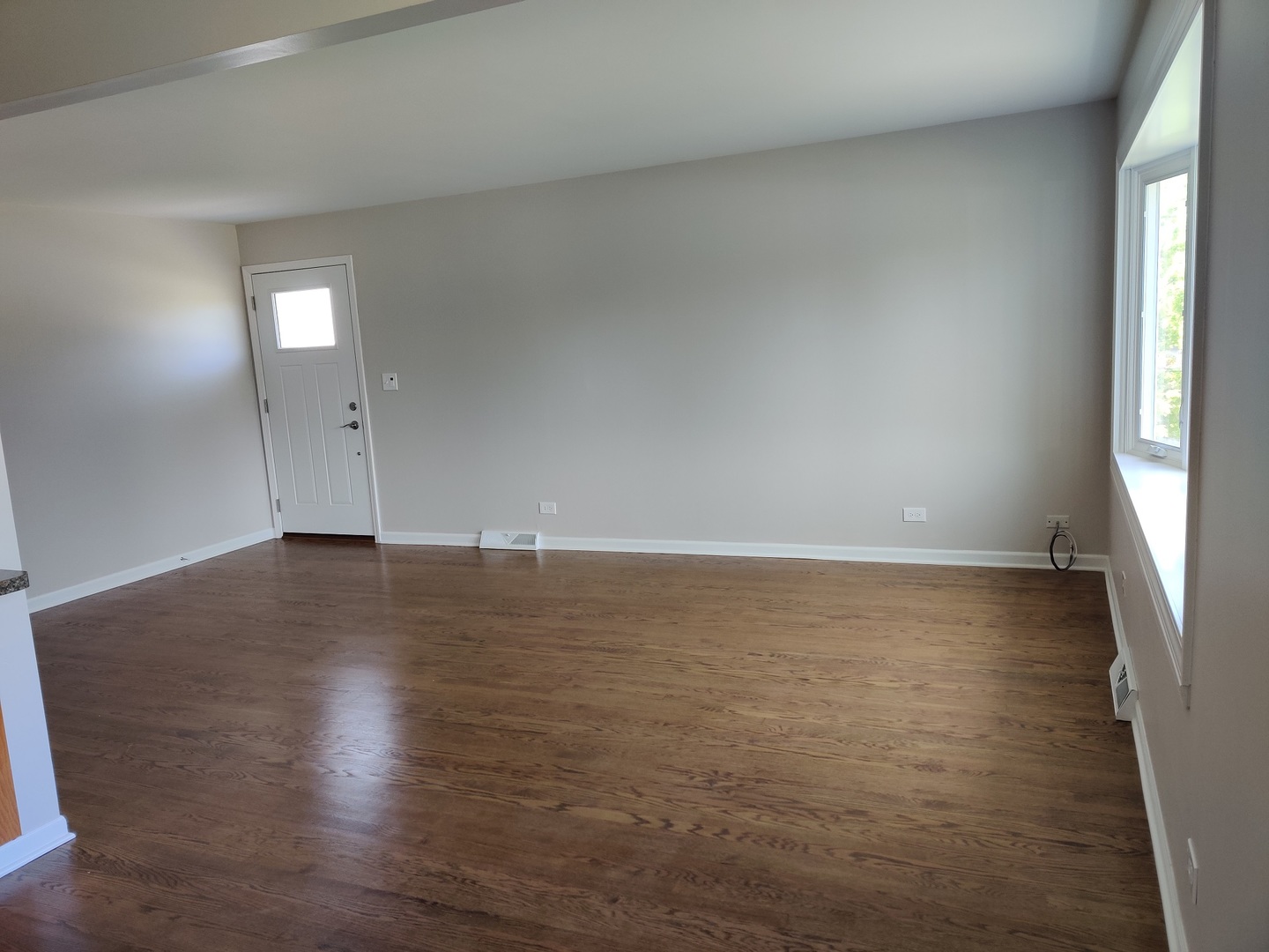 4324 Cumnor Road Downers Grove, IL 60515 - Photo 3 of 12 an empty room with wooden floor and windows