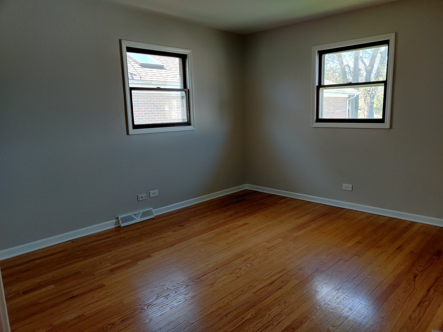 4324 Cumnor Road Downers Grove, IL 60515 - Photo 6 of 12 a view of a room with wooden floor and windows