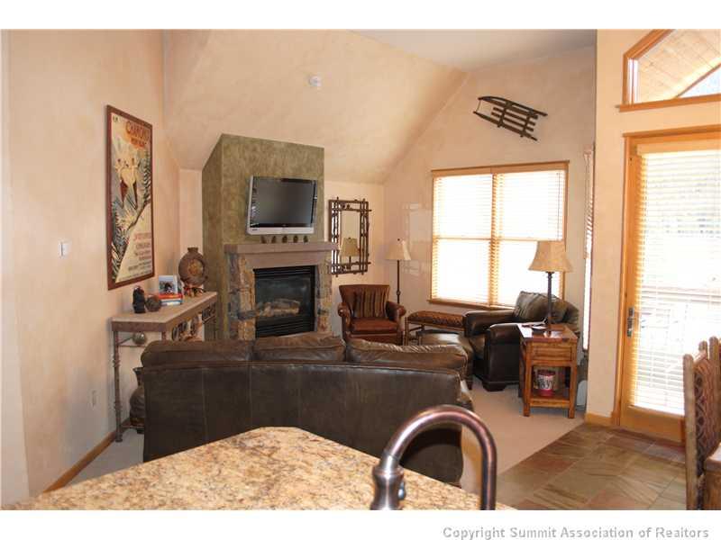 195 River Run Road, Unit 8072 Keystone, CO 80435 - Photo 3 of 7 a kitchen with a refrigerator and a stove