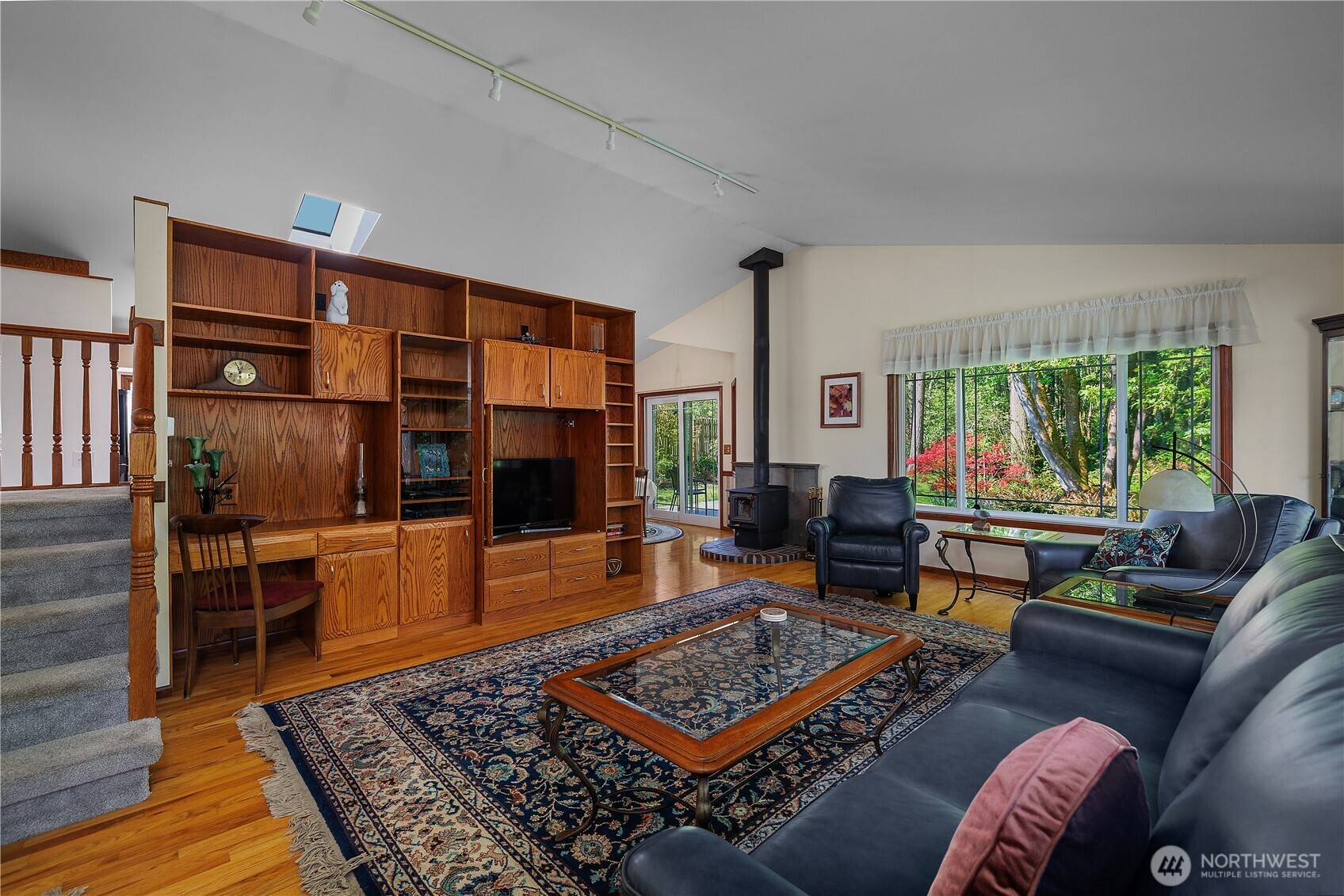 5629 Sleater Kinney Road Northeast Olympia, WA 98506 - Photo 11 of 32 a living room with furniture and a rug