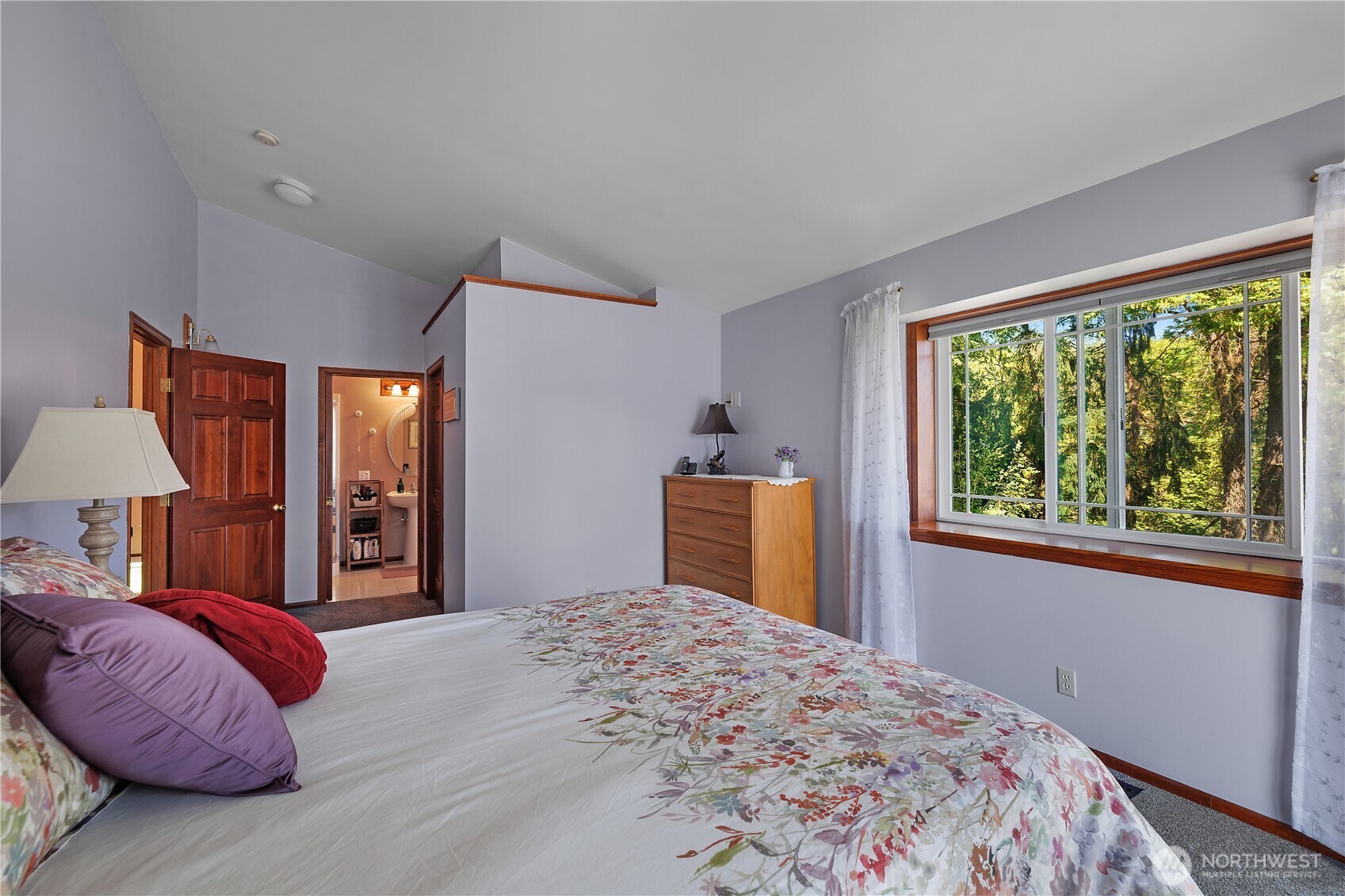 5629 Sleater Kinney Road Northeast Olympia, WA 98506 - Photo 20 of 32 a bedroom with a large bed and a window