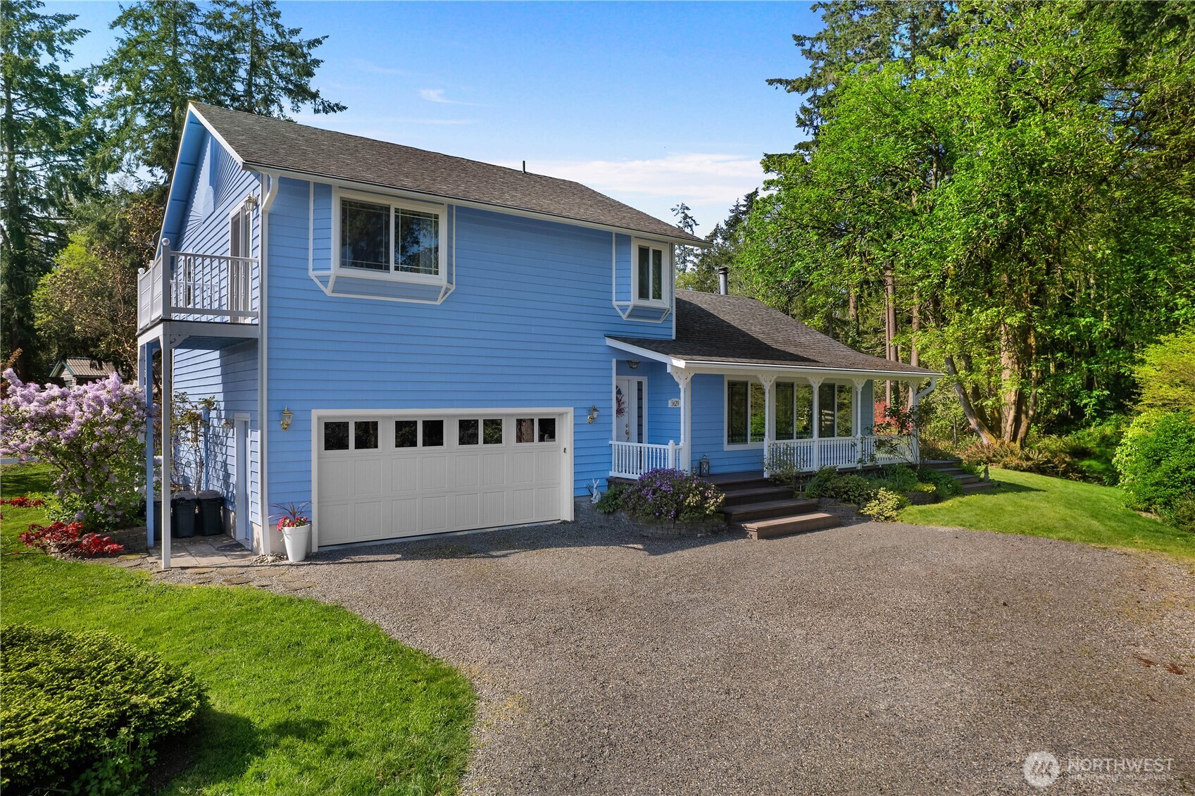 5629 Sleater Kinney Road Northeast Olympia, WA 98506 - Photo 2 of 32 a view of a house with a yard and a large tree