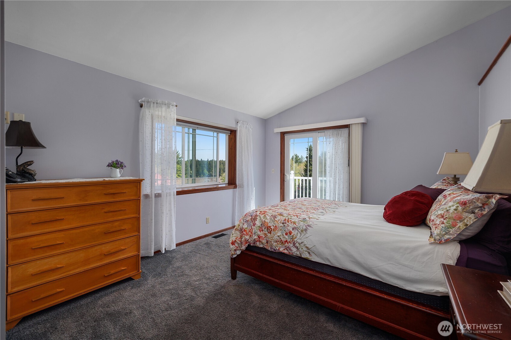 5629 Sleater Kinney Road Northeast Olympia, WA 98506 - Photo 21 of 32 a bedroom with a bed and a window