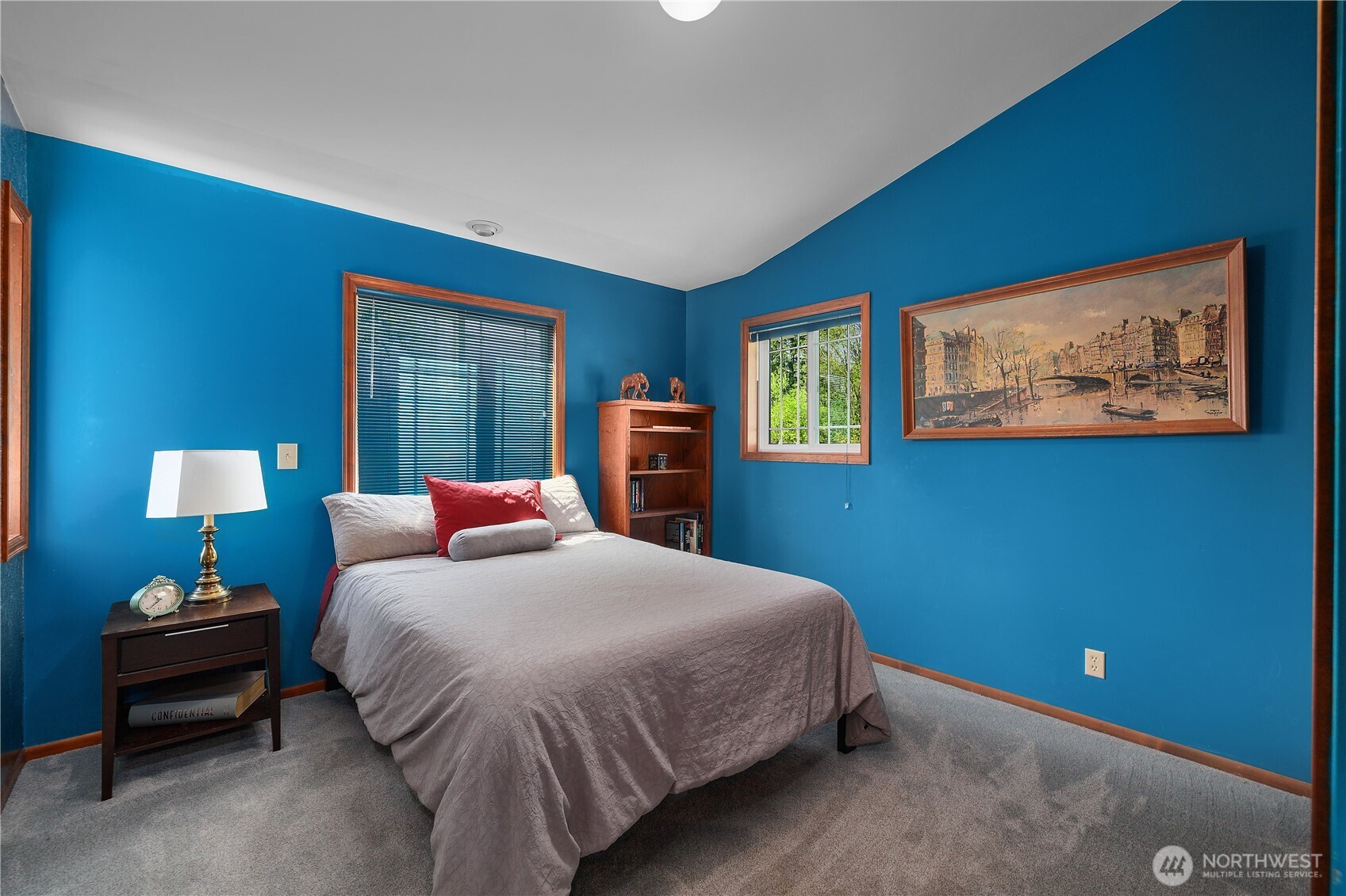 5629 Sleater Kinney Road Northeast Olympia, WA 98506 - Photo 23 of 32 a bedroom with a bed and a night stand