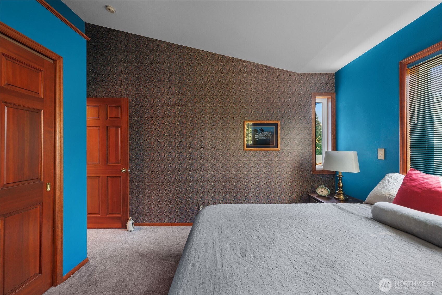 5629 Sleater Kinney Road Northeast Olympia, WA 98506 - Photo 24 of 32 a bedroom with a bed and a lamp