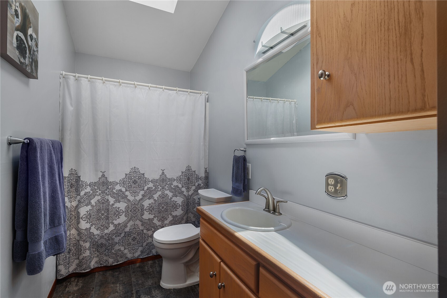 5629 Sleater Kinney Road Northeast Olympia, WA 98506 - Photo 26 of 32 a bathroom with a granite countertop sink toilet and mirror