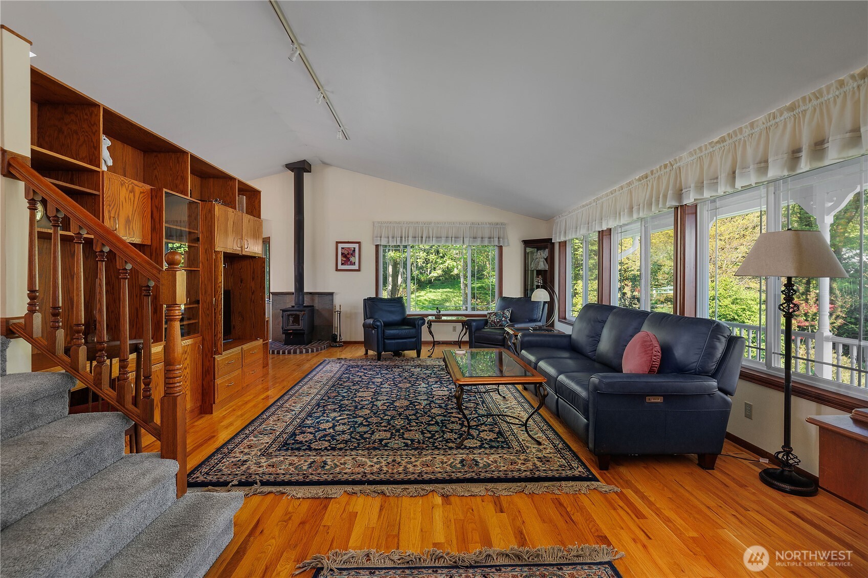 5629 Sleater Kinney Road Northeast Olympia, WA 98506 - Photo 9 of 32 a living room with furniture and a flat screen tv