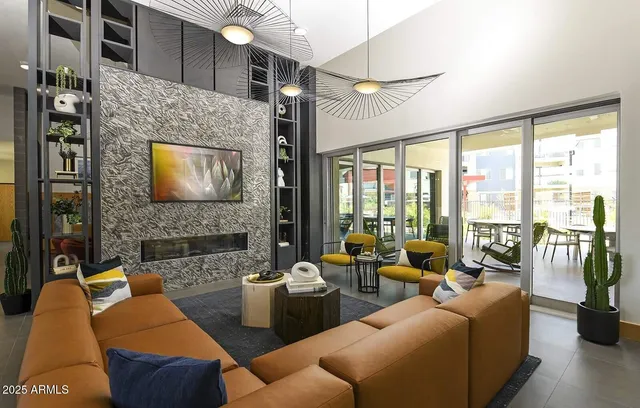 a living room with furniture fireplace and flat screen tv