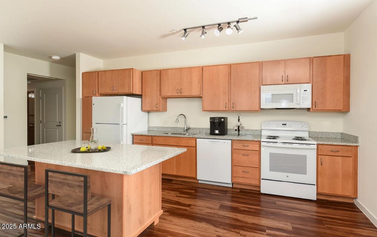 7800 West Encanto Boulevard, Unit 3 Phoenix, AZ 85035 - Photo 3 of 15 a kitchen with stainless steel appliances granite countertop a sink stove and refrigerator