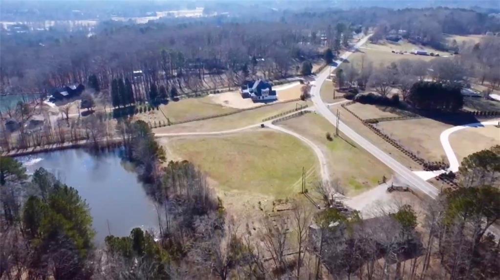 830 Arnold Mill Road Woodstock, GA 30188 - Photo 8 of 10 a view of a swimming pool with a yard