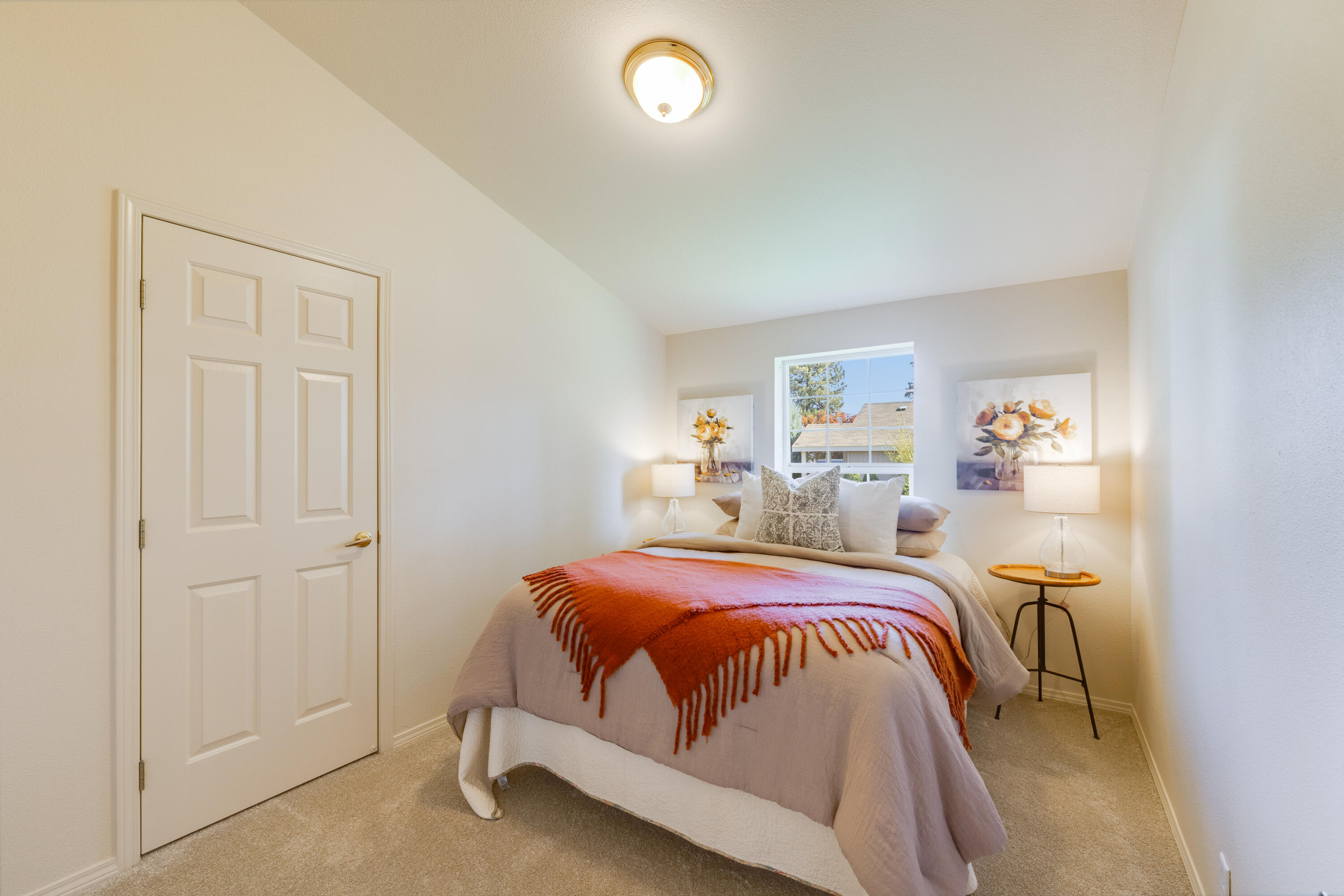 278 North Wheeler Loop Sisters, OR 97759 - Photo 14 of 22 a bedroom with a bed and a window