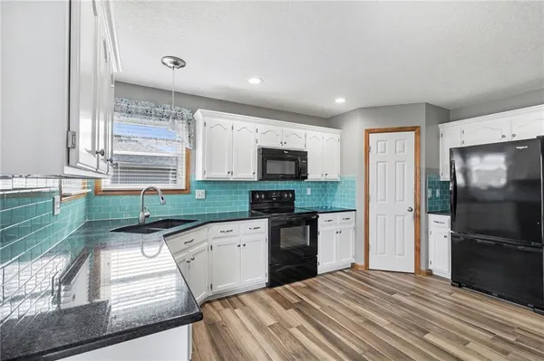 $305,000 | 448 Southwest Laura Lane, Grain Valley, MO 64029