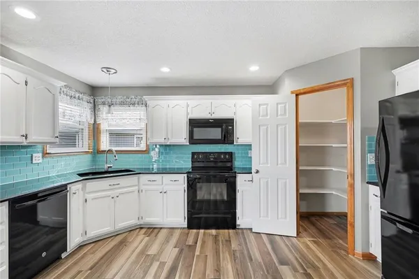 $305,000 | 448 Southwest Laura Lane, Grain Valley, MO 64029