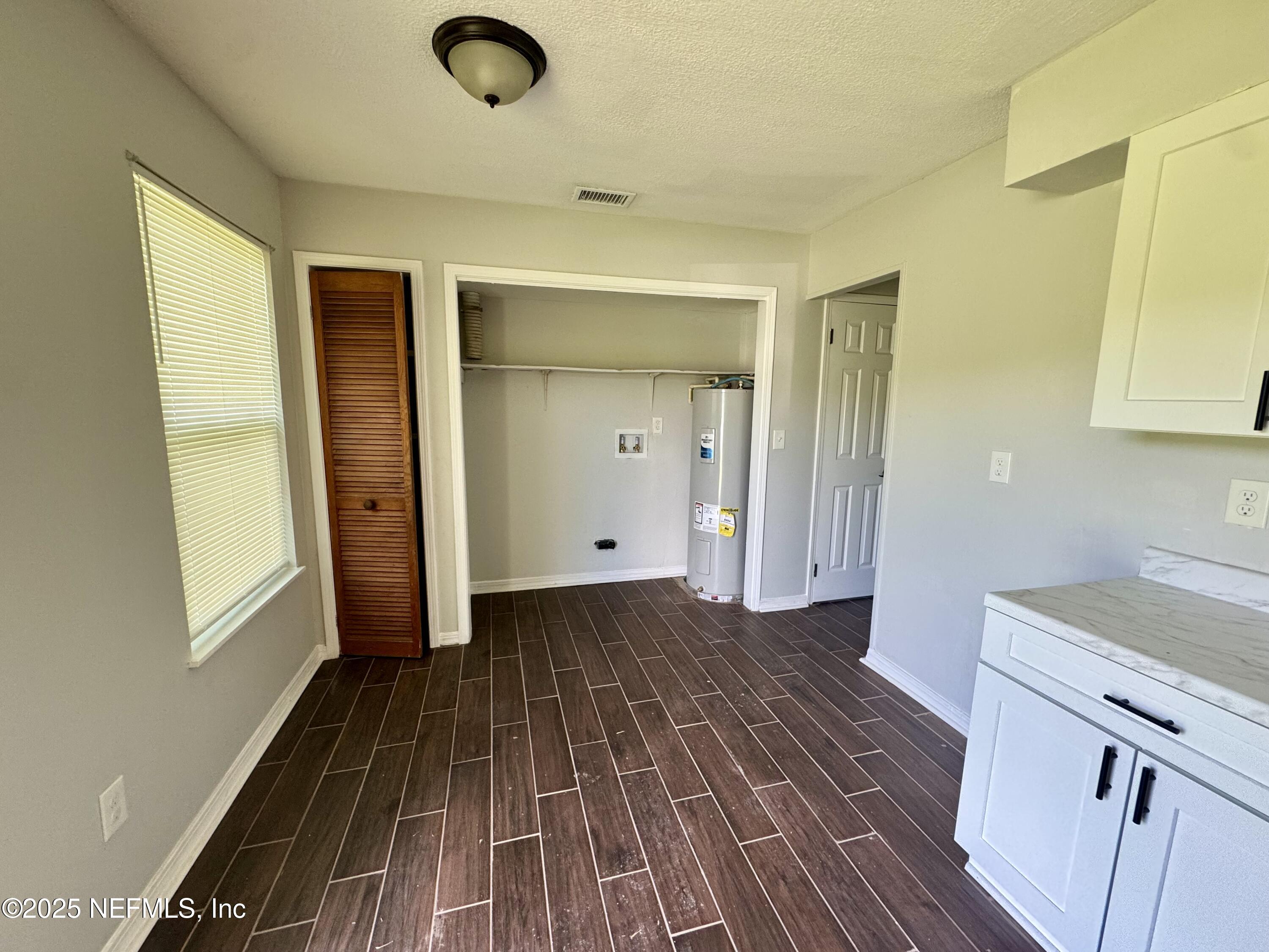 707 Rainer Road, Unit 3 Baldwin, FL 32234 - Photo 5 of 11 a view of a kitchen from the hallway