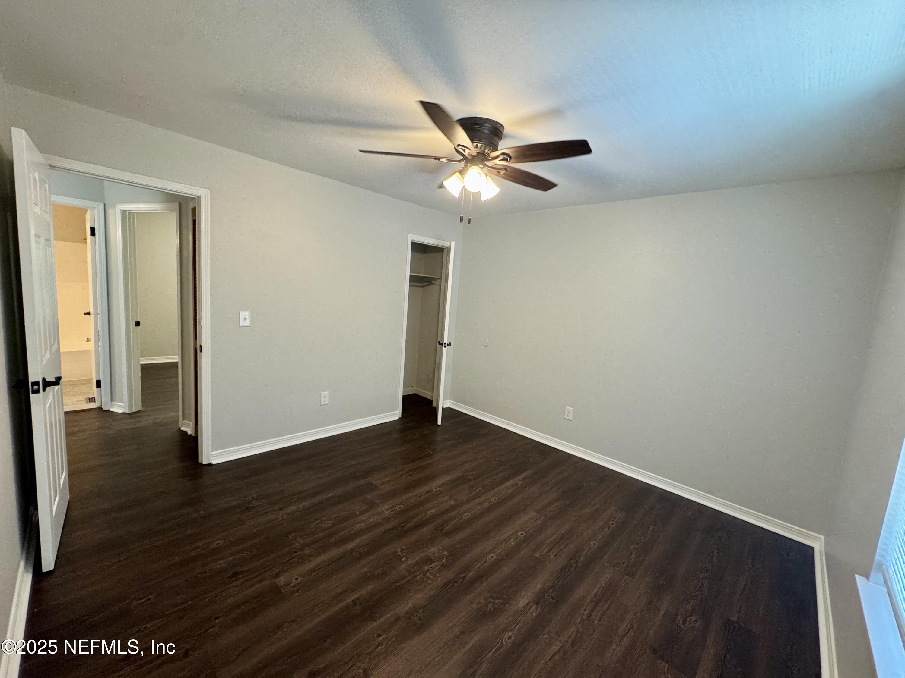 707 Rainer Road, Unit 3 Baldwin, FL 32234 - Photo 9 of 11 a view of an empty room with wooden floor