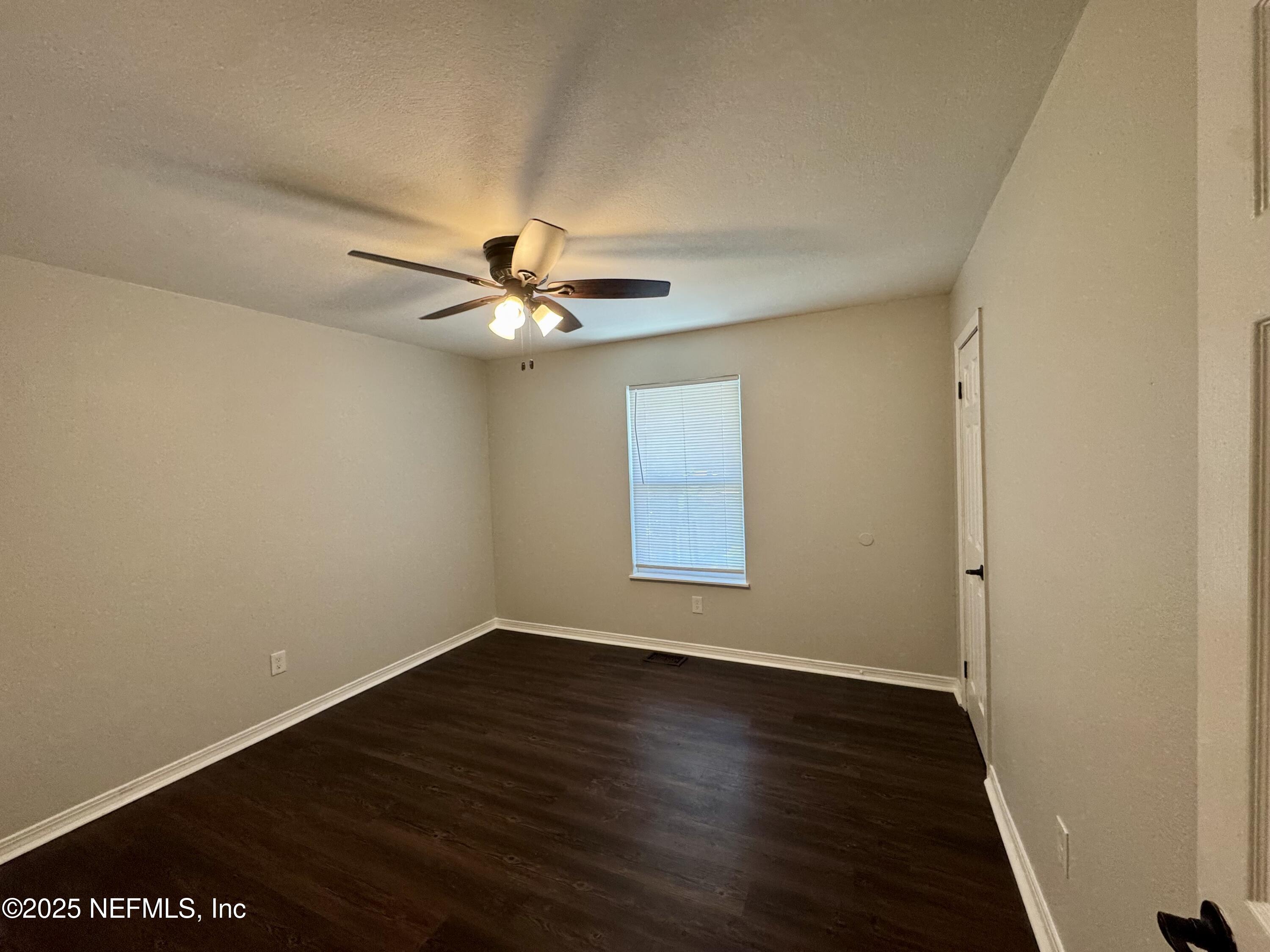 707 Rainer Road, Unit 3 Baldwin, FL 32234 - Photo 10 of 11 wooden floor in an empty room