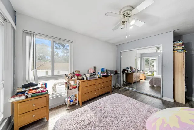 a bed room with a bed and a window