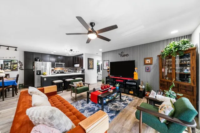 a living room with furniture and a flat screen tv