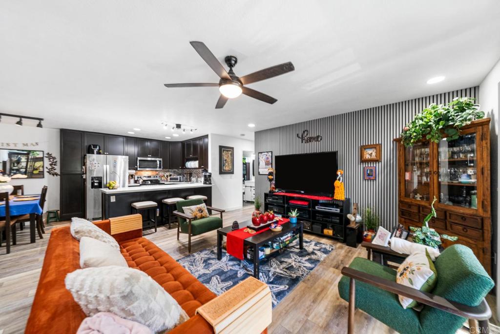 500 Telegraph Canyon Road, Unit H Chula Vista, CA 91910 - Photo 12 of 36 a living room with furniture and a flat screen tv
