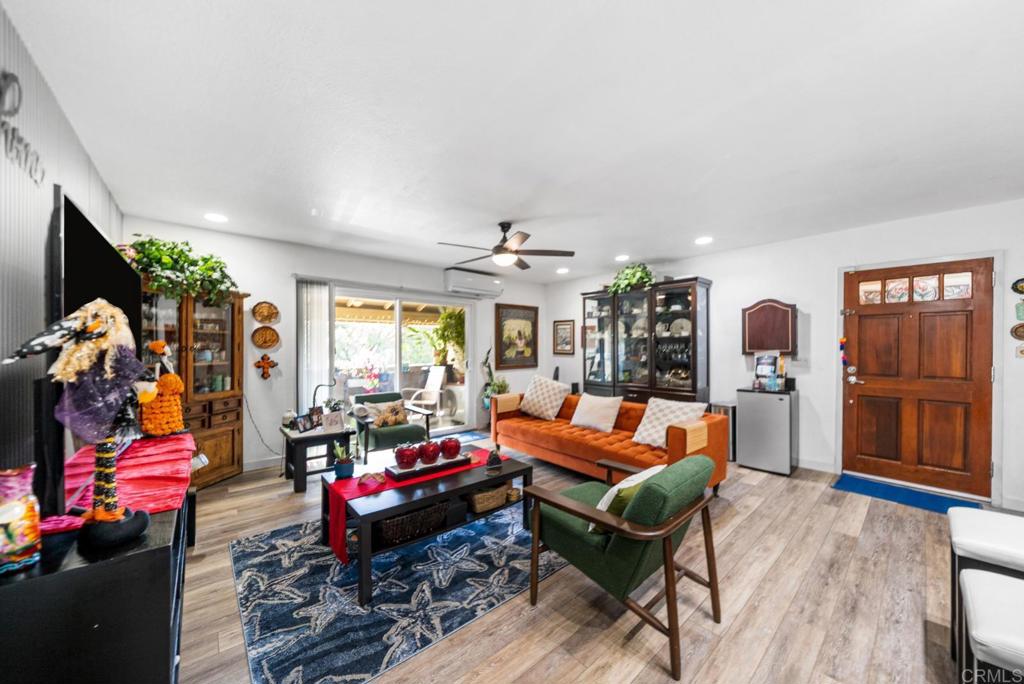 500 Telegraph Canyon Road, Unit H Chula Vista, CA 91910 - Photo 14 of 36 a living room with patio furniture and a flat screen tv