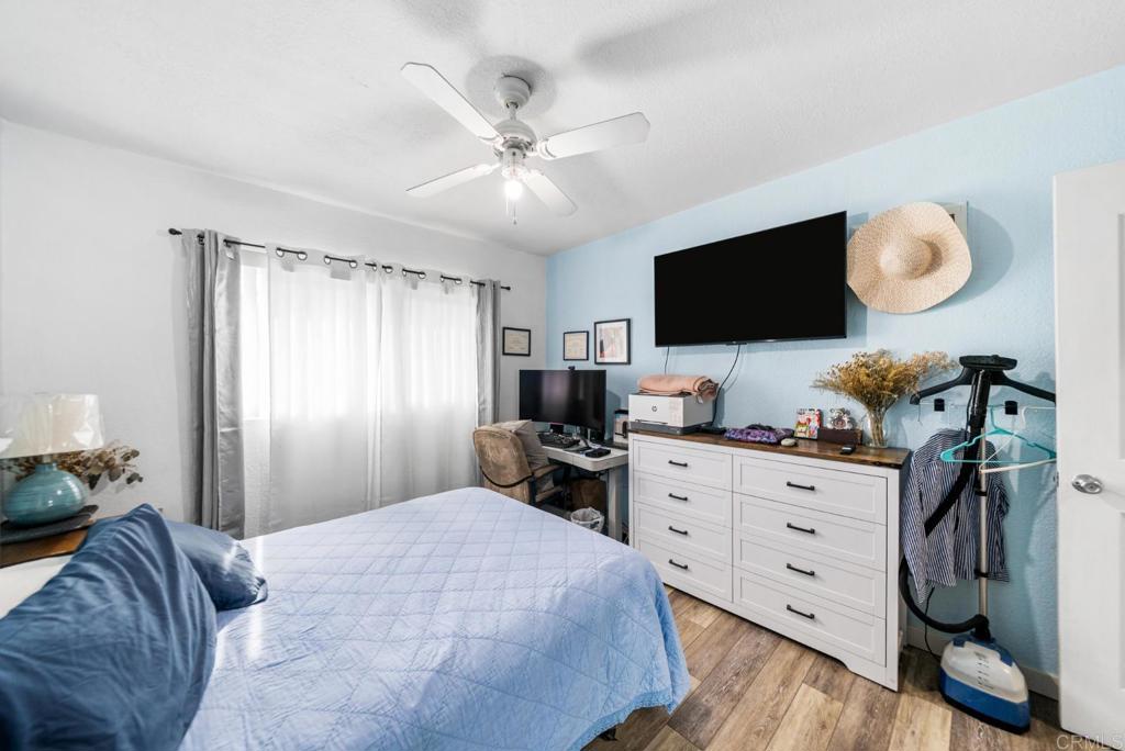 500 Telegraph Canyon Road, Unit H Chula Vista, CA 91910 - Photo 15 of 36 a bedroom with a bed and flat screen tv
