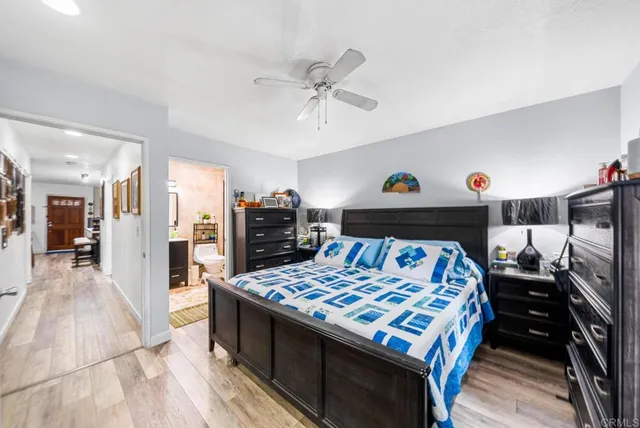 a bedroom with a bed and a table